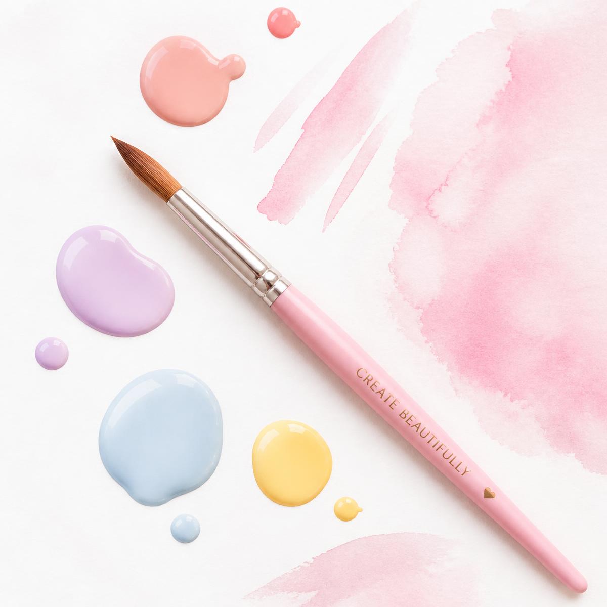 Pink paint brush surrounded by colourful paint drops